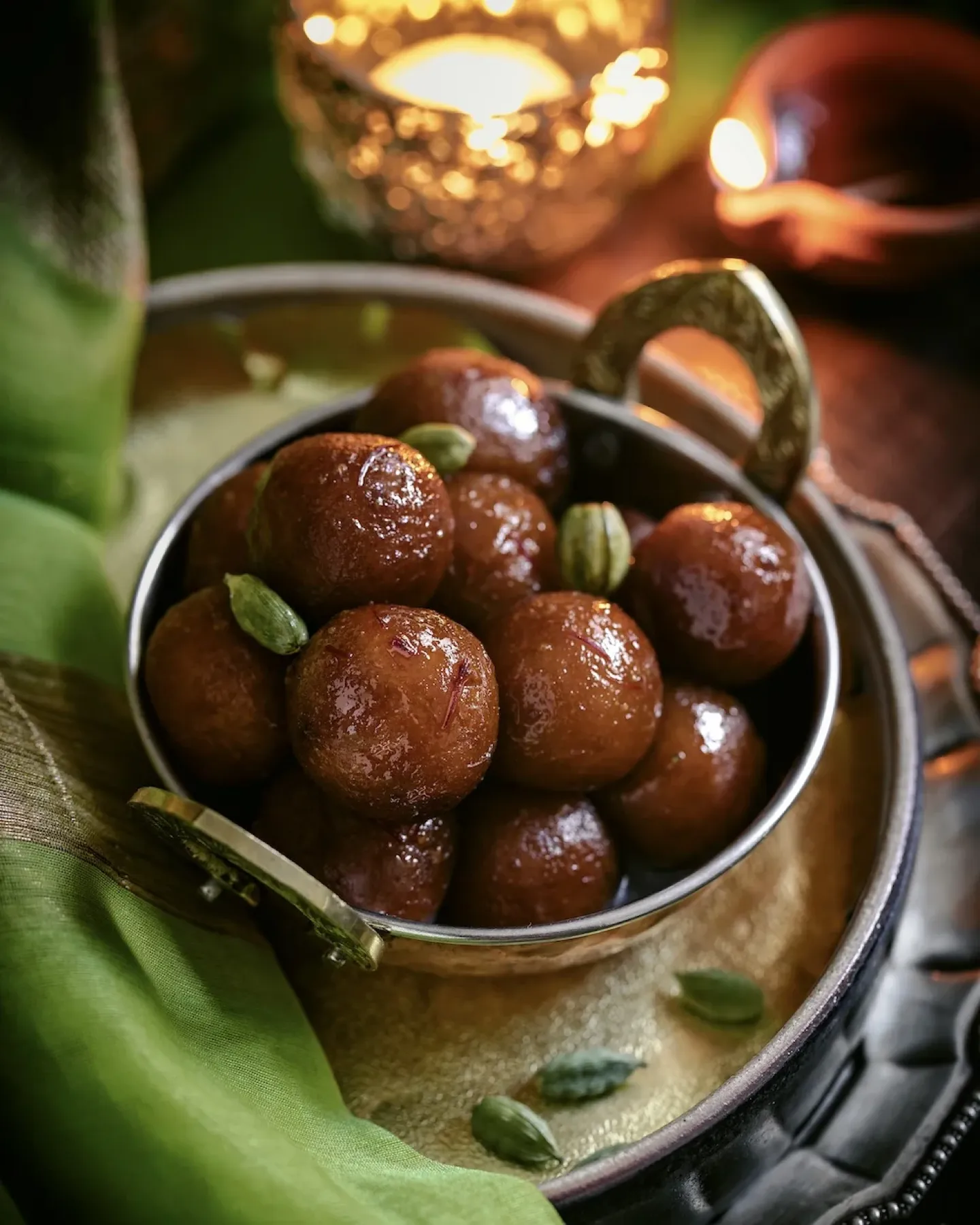 Homemade gulab jamuns in rose and cardamom syrup